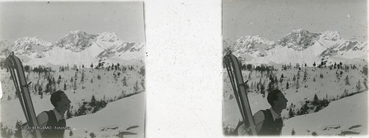 Dal rifugio Alpe Corte vista sul Corna Piano e Pizzo Arera con scialpinista in primo piano