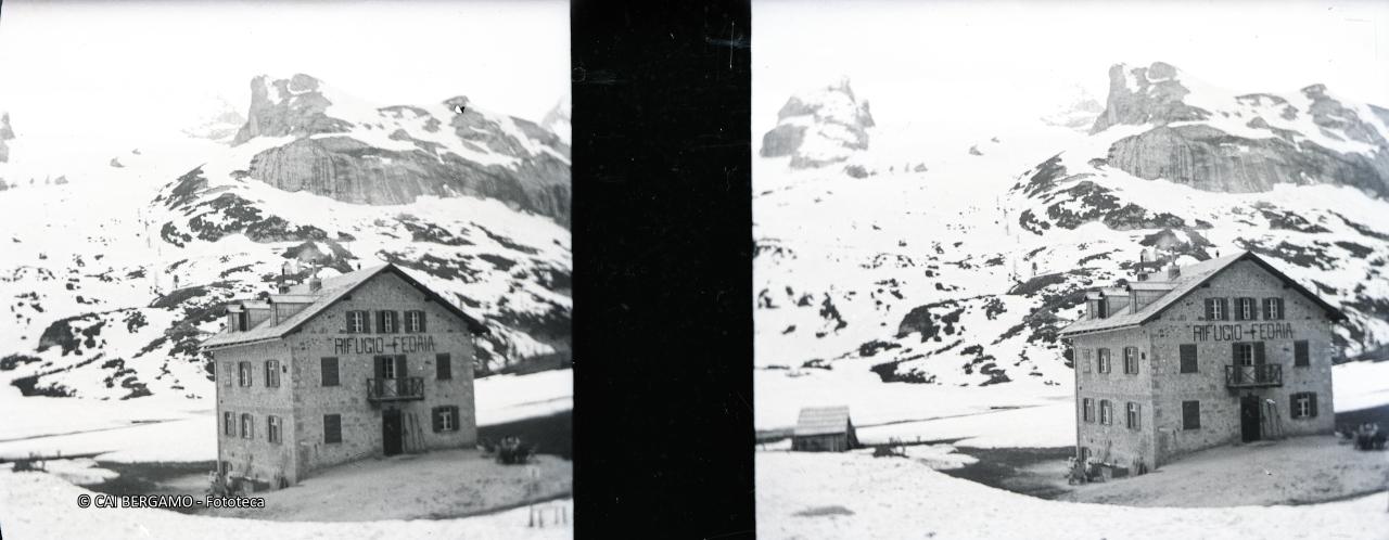 Rifugio Fedaia con la Marmolada nelle nebbie 
