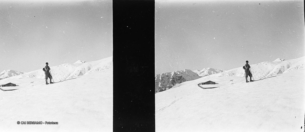 Sciatore e malga alta Vaccaro