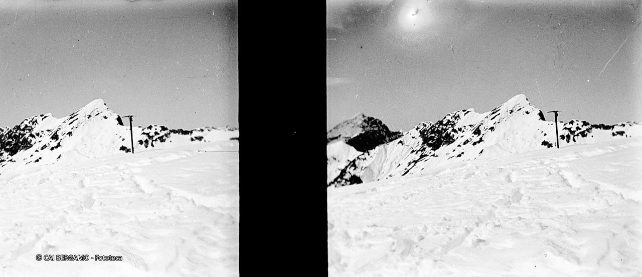 Cima del Fop con piccozza in primo piano