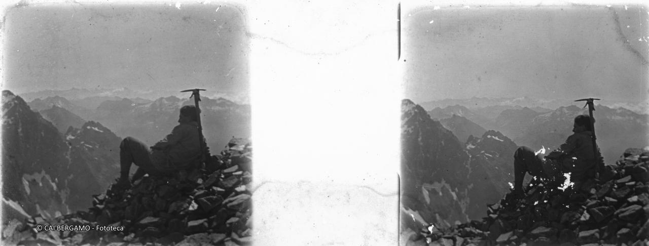 Sul Redorta ben seduto ed appoggiato alla piccozza, scorcio del pizzo Coca